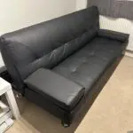 3 seater black faux leather click clack sofa bed