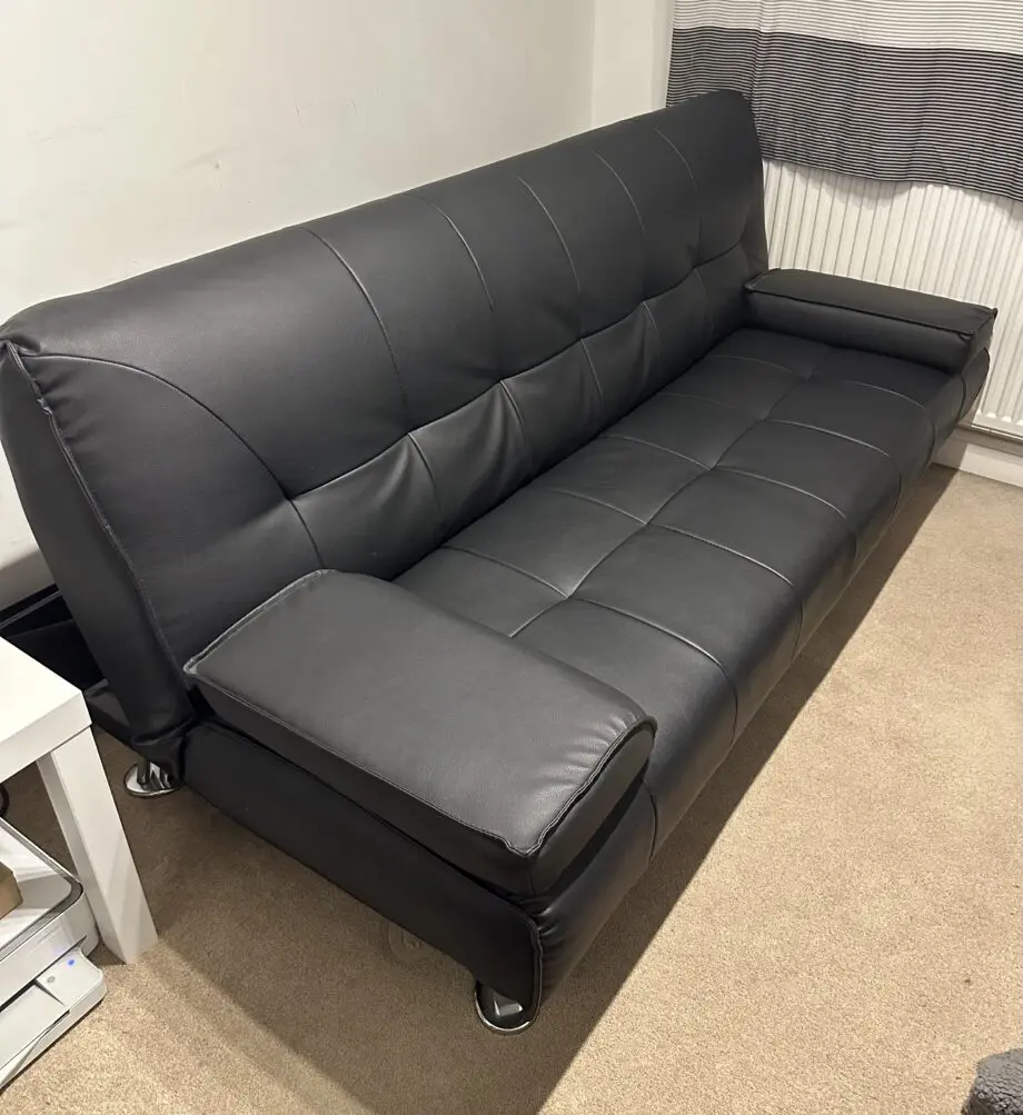 3 seater black faux leather click clack sofa bed
