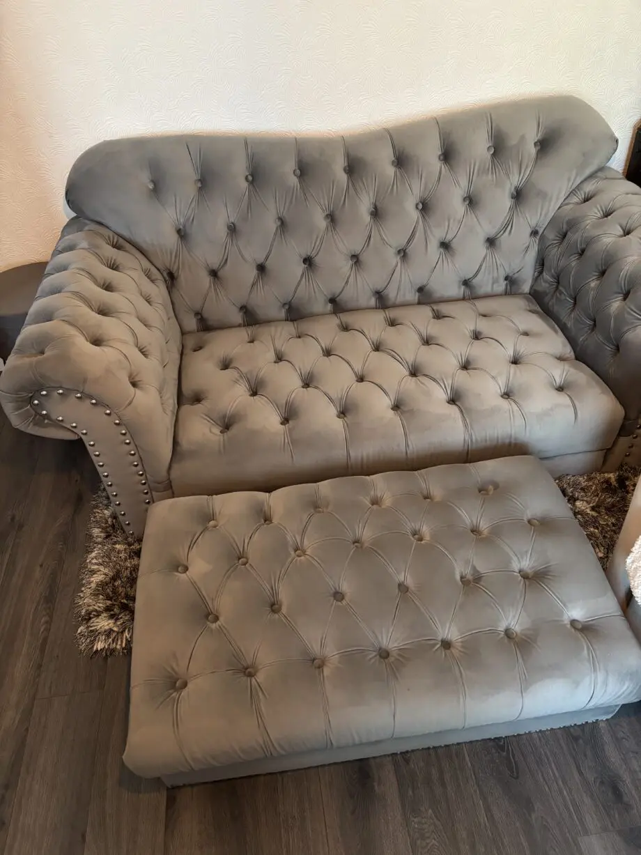 Grey velour Chesterfield 2/3 seater sofa and puffa