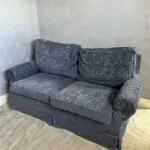 Deep blue sofa bed with footstool