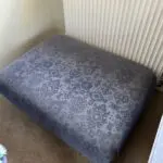 Deep blue sofa bed with footstool