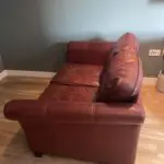 Large 2 seater red leather Lazy Boy, used but good condition