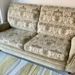 Vale / Bridgecraft 3 seater sofa in green fabric. Cushions are floral pattern.