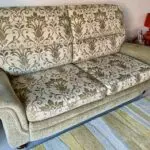 Vale / Bridgecraft 3 seater sofa in green fabric. Cushions are floral pattern.