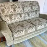 Vale / Bridgecraft 3 seater sofa in green fabric. Cushions are floral pattern.
