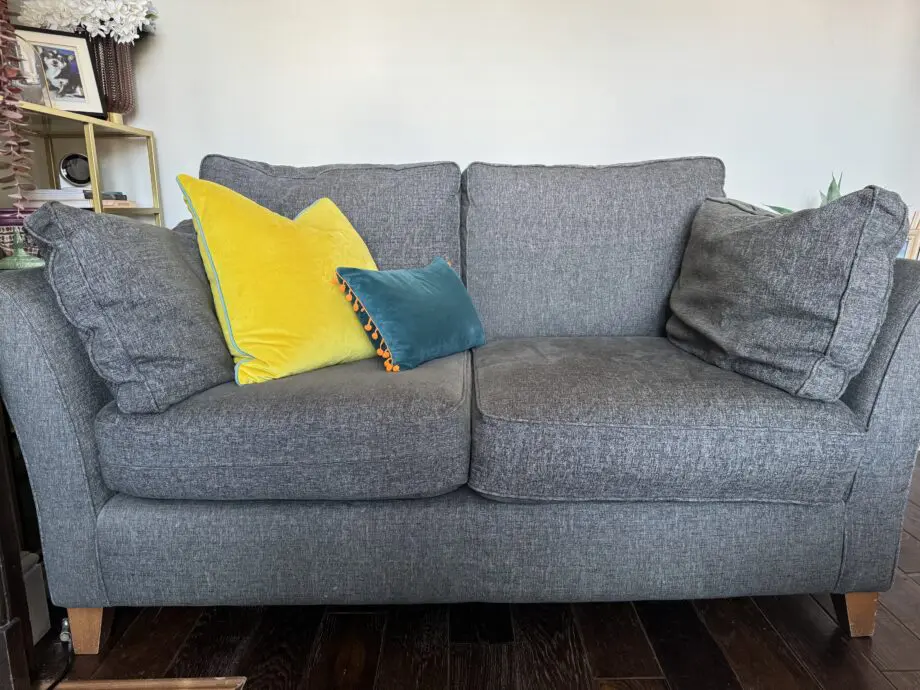 Grey upholstered 2 seater sofa