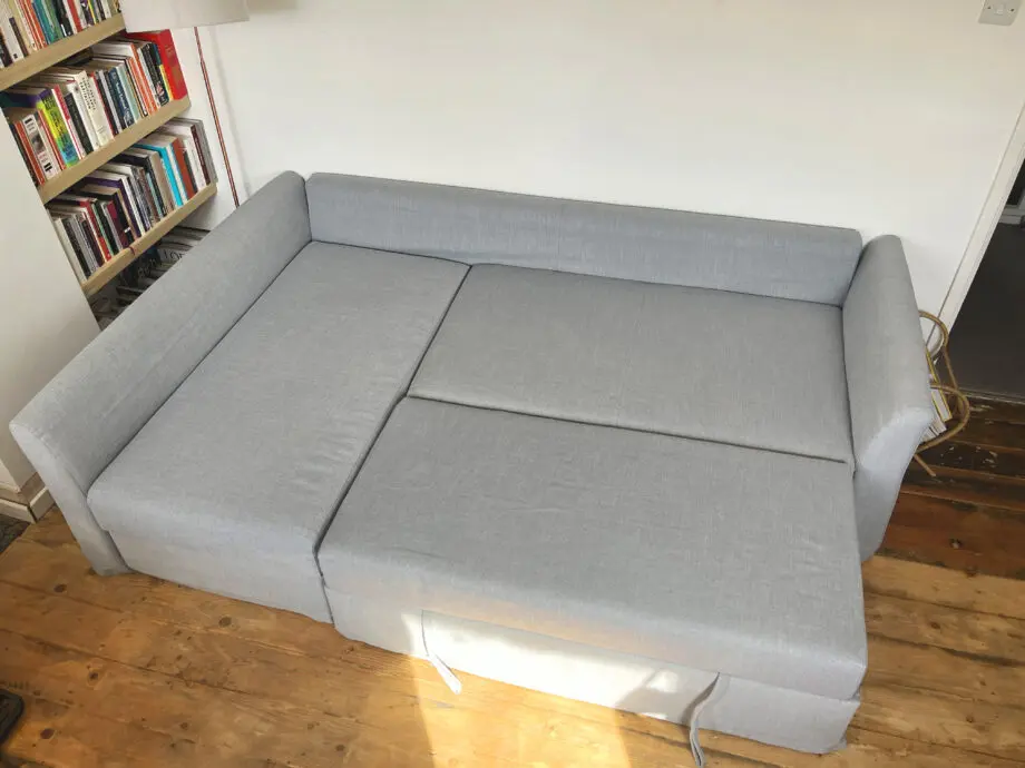 Grey IKEA HOLMSUND corner sofa-bed