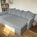 Grey IKEA HOLMSUND corner sofa-bed