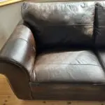 Next Dark Brown Leather 2 seater Sofa with dark wooden block feet