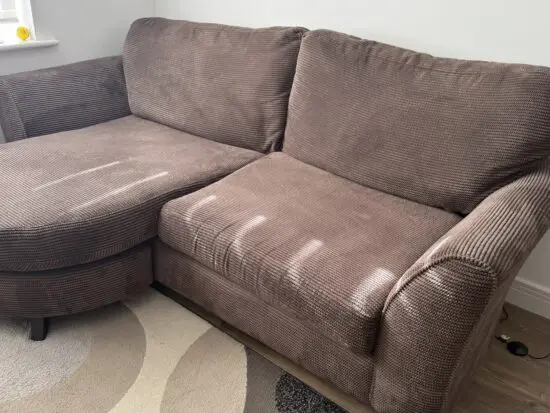 Brown Sofa with chaise .