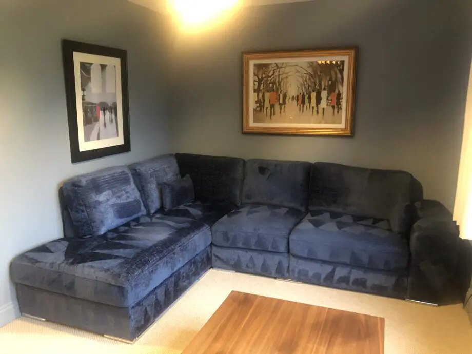 Blue velour corner settee by Quattropi
