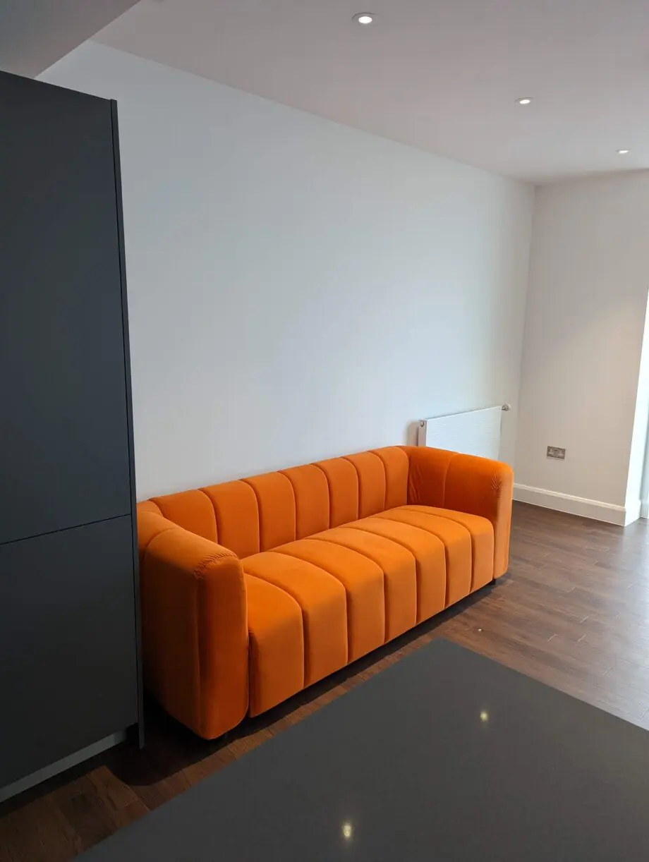 Modern and cool 3 seater sofa in orange, great condition