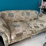Sofa Workshop Beige Sofa with embroidered blue flowers.