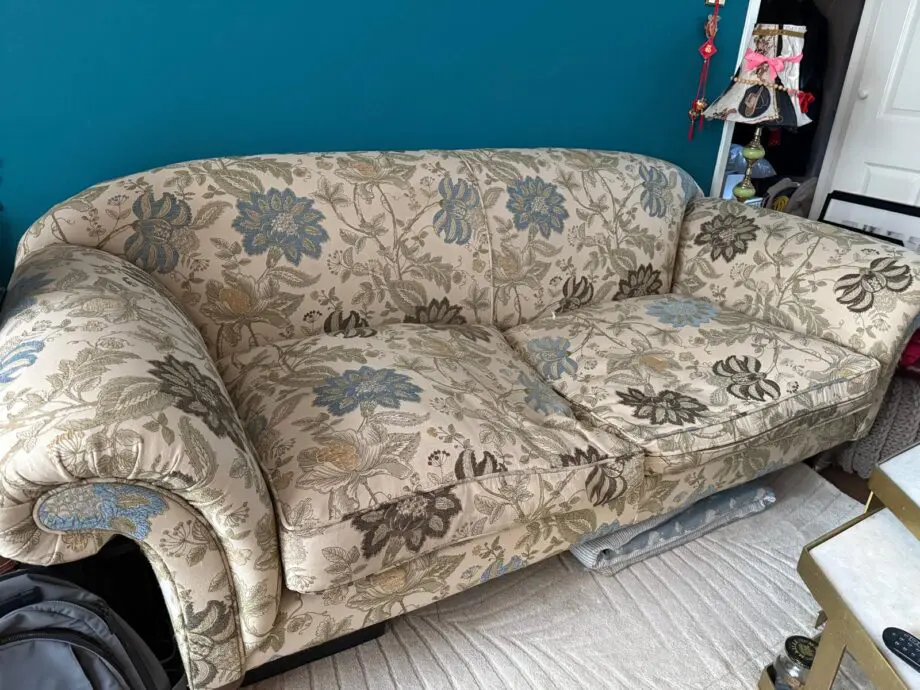 Sofa Workshop Beige Sofa with embroidered blue flowers.