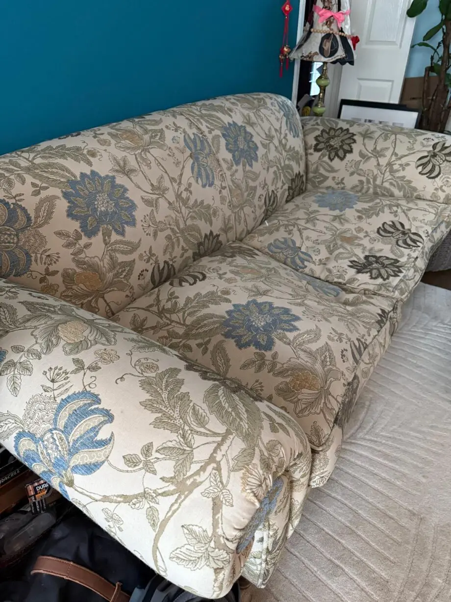 Sofa Workshop Beige Sofa with embroidered blue flowers.