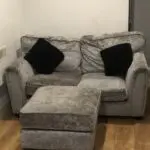 Grey 2 sofa seater with foot rest