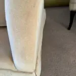 Parker knoll two seater (large) velvet sofa with the colour of a warm beige with pink tone.