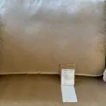Parker knoll two seater (large) velvet sofa with the colour of a warm beige with pink tone.