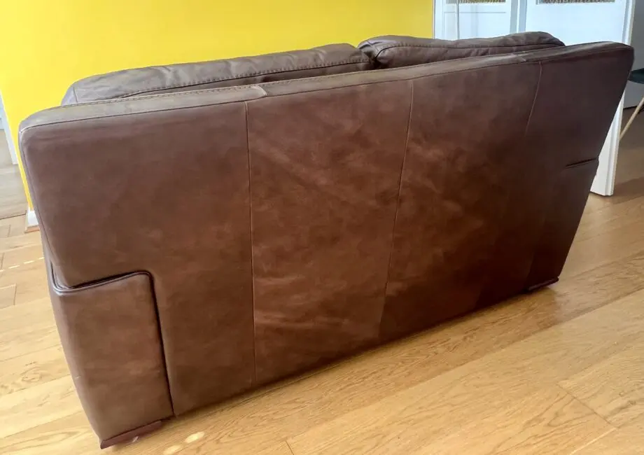 2 high quality leather sofas and footstool made by David Paine Associates for John Lewis. Style is Baltimore a modern interpretation of a retro classic
