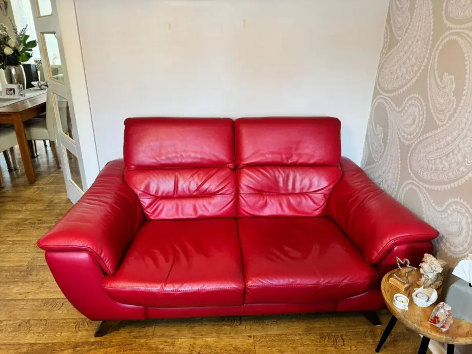 DFS red 2 x 2 seater Sofas with reclining headrests + footstool with silver feet