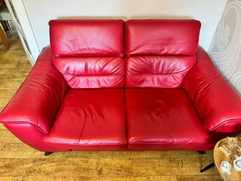 DFS red 2 x 2 seater Sofas with reclining headrests + footstool with silver feet