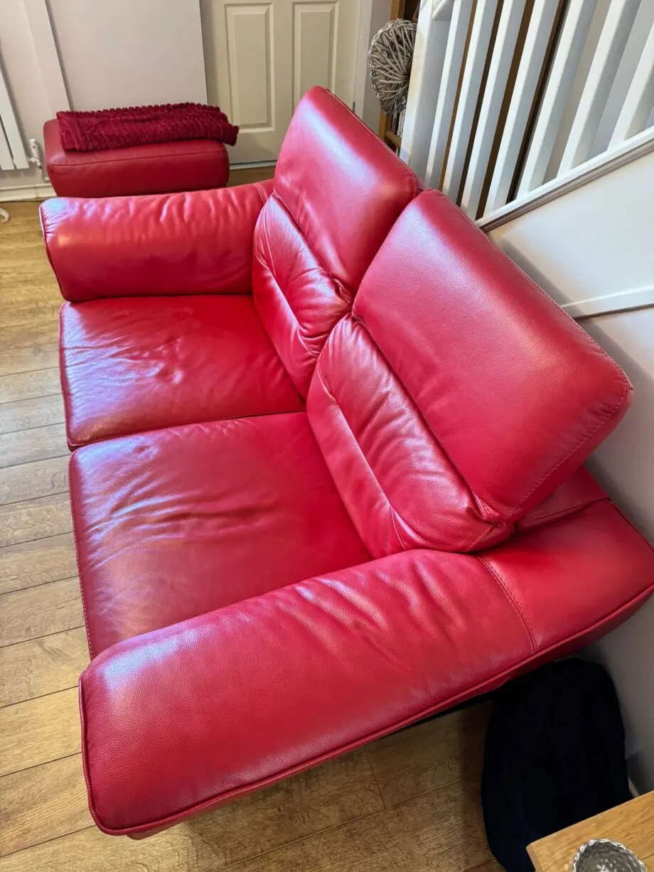 DFS red 2 x 2 seater Sofas with reclining headrests + footstool with silver feet