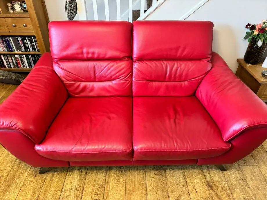 DFS red 2 x 2 seater Sofas with reclining headrests + footstool with silver feet