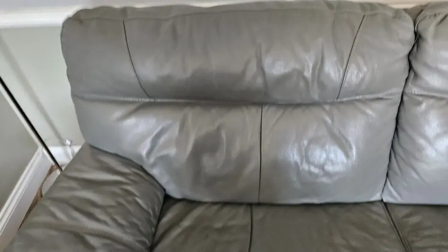 2 Grey leather 2 seater sofas with poof