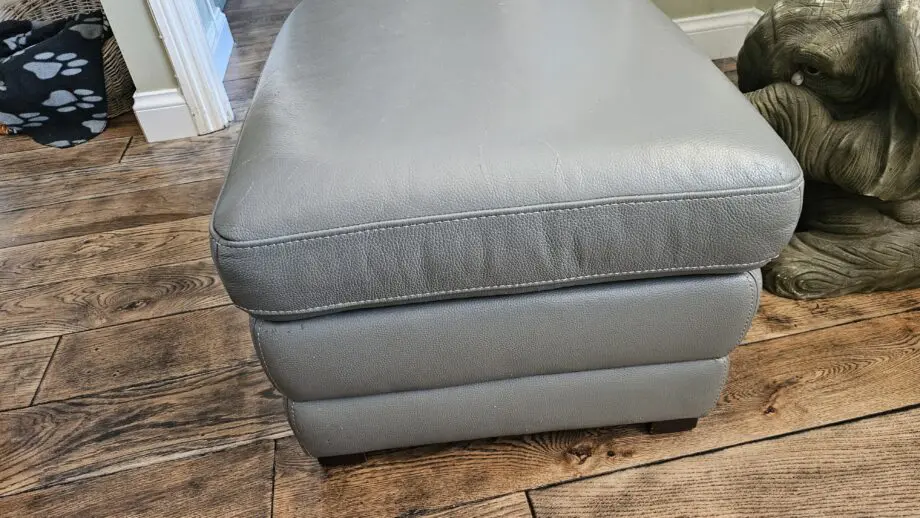 2 Grey leather 2 seater sofas with poof