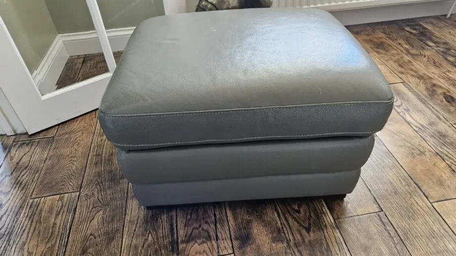 2 Grey leather 2 seater sofas with poof