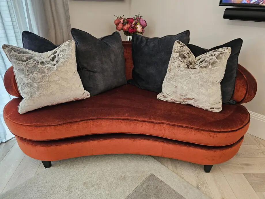 Orange two seater corner sofa