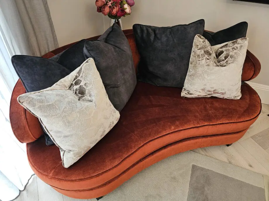Orange two seater corner sofa