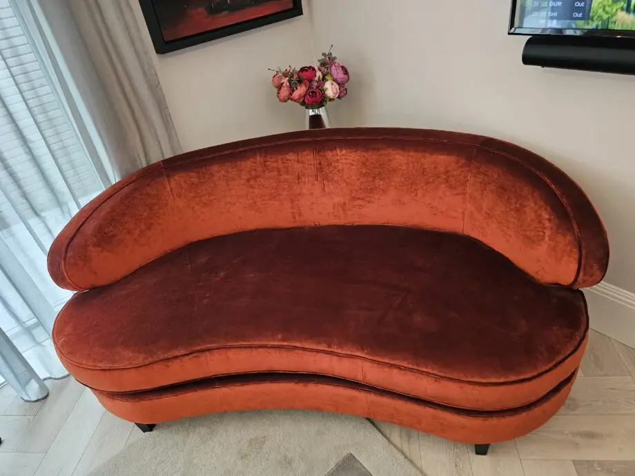 Orange two seater corner sofa