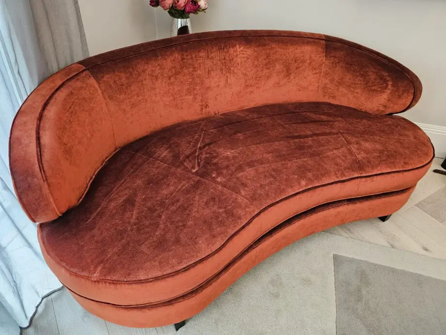Orange two seater corner sofa