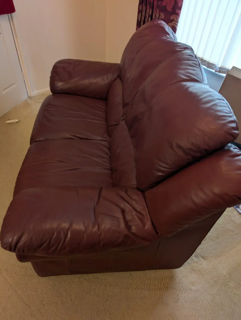 DFS Burgundy/Maroon Leather 2 seater sofa