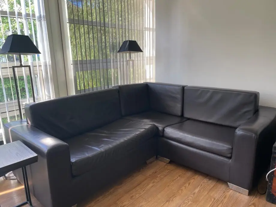 Designer leather L-shaped sofa with square chrome feet