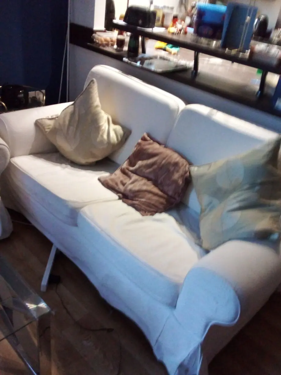 2 white two seater sofas