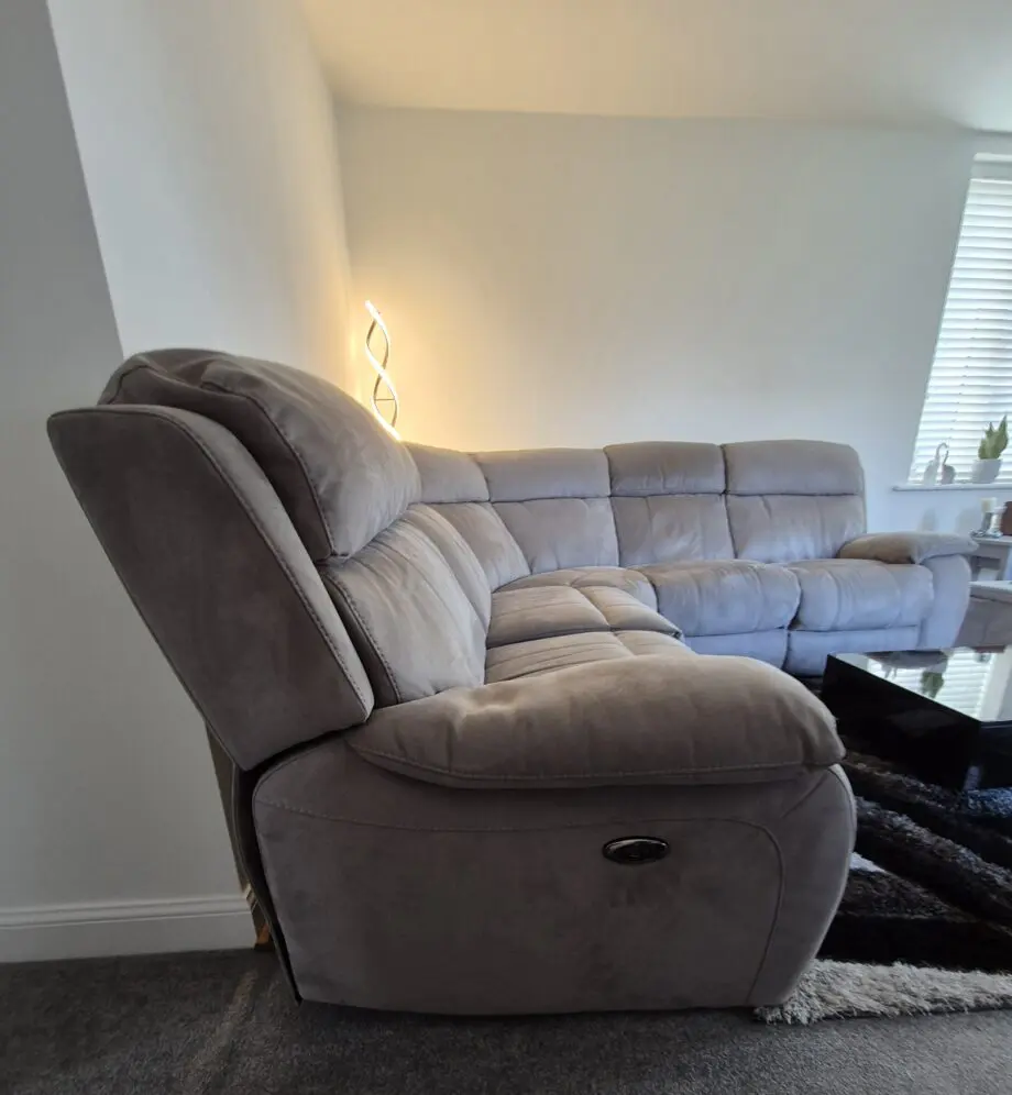 Grey, corner, reclining sofa for sale.