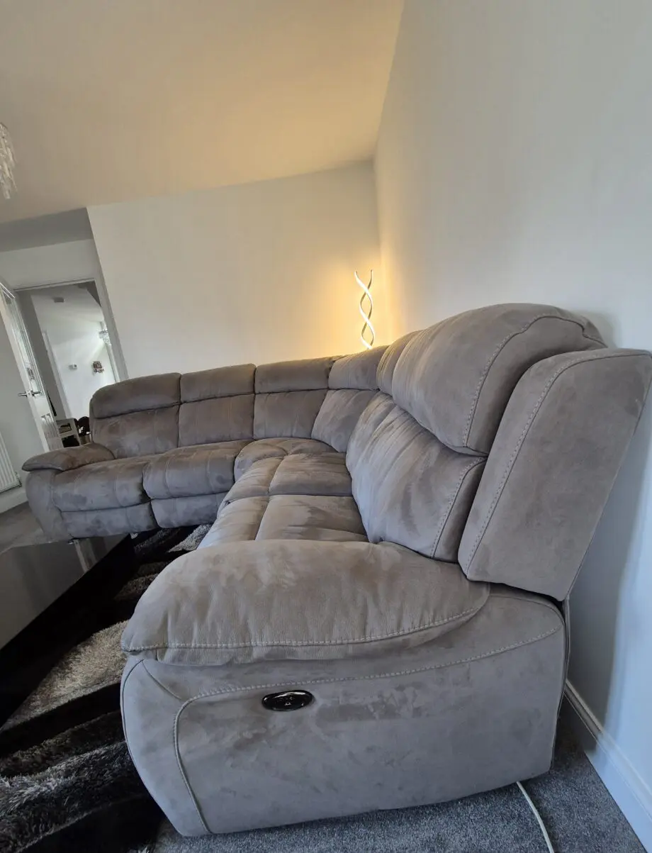 Grey, corner, reclining sofa for sale.