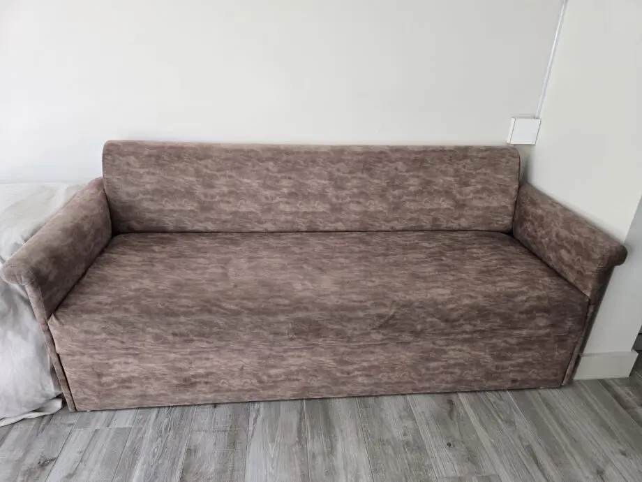 3-Seater Sofa, Beige Colour. Few scuff marks and nail-heads visible on the sides, due to extra reinforcement done.