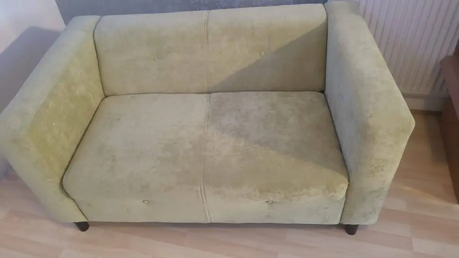 Green two seater sofa