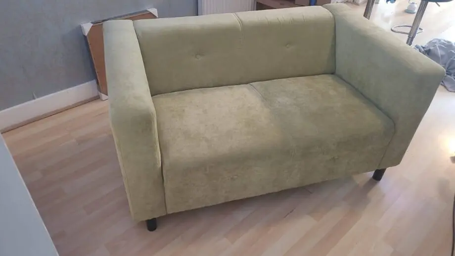 Green two seater sofa