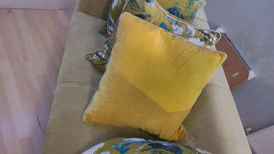 Green two seater sofa