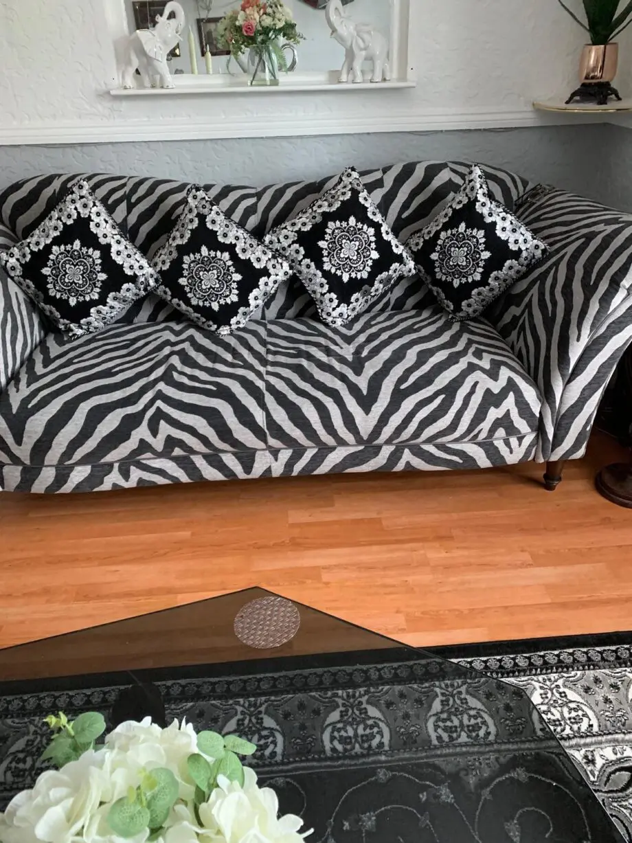 Light grey and black zebra print sofa