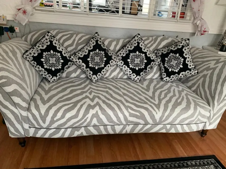 White and grey zebra print sofa