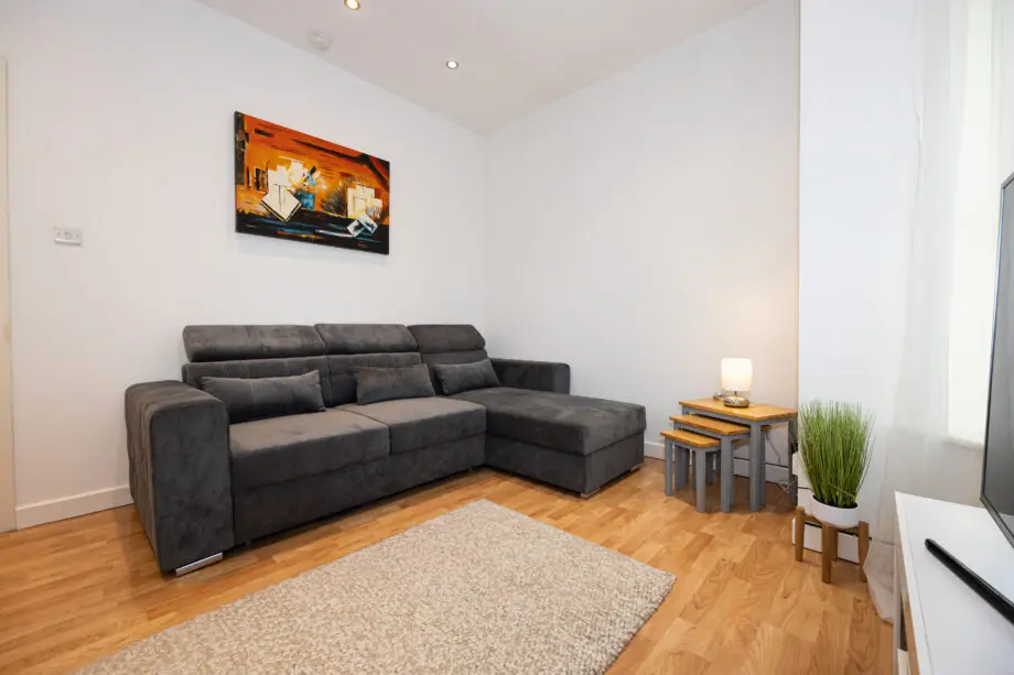 Grey L-shaped sofa bed
