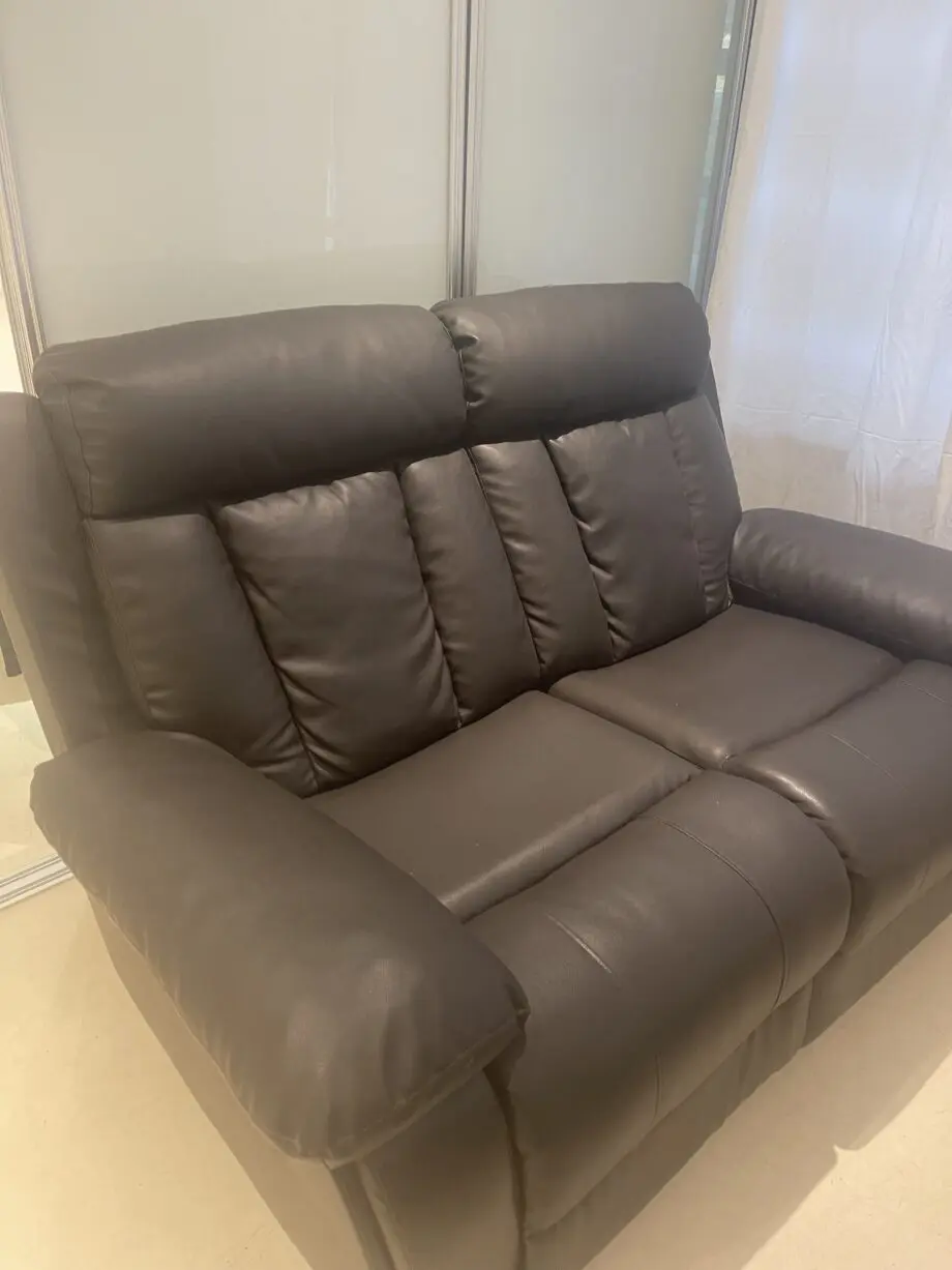 Used two seater faux leather sofa
