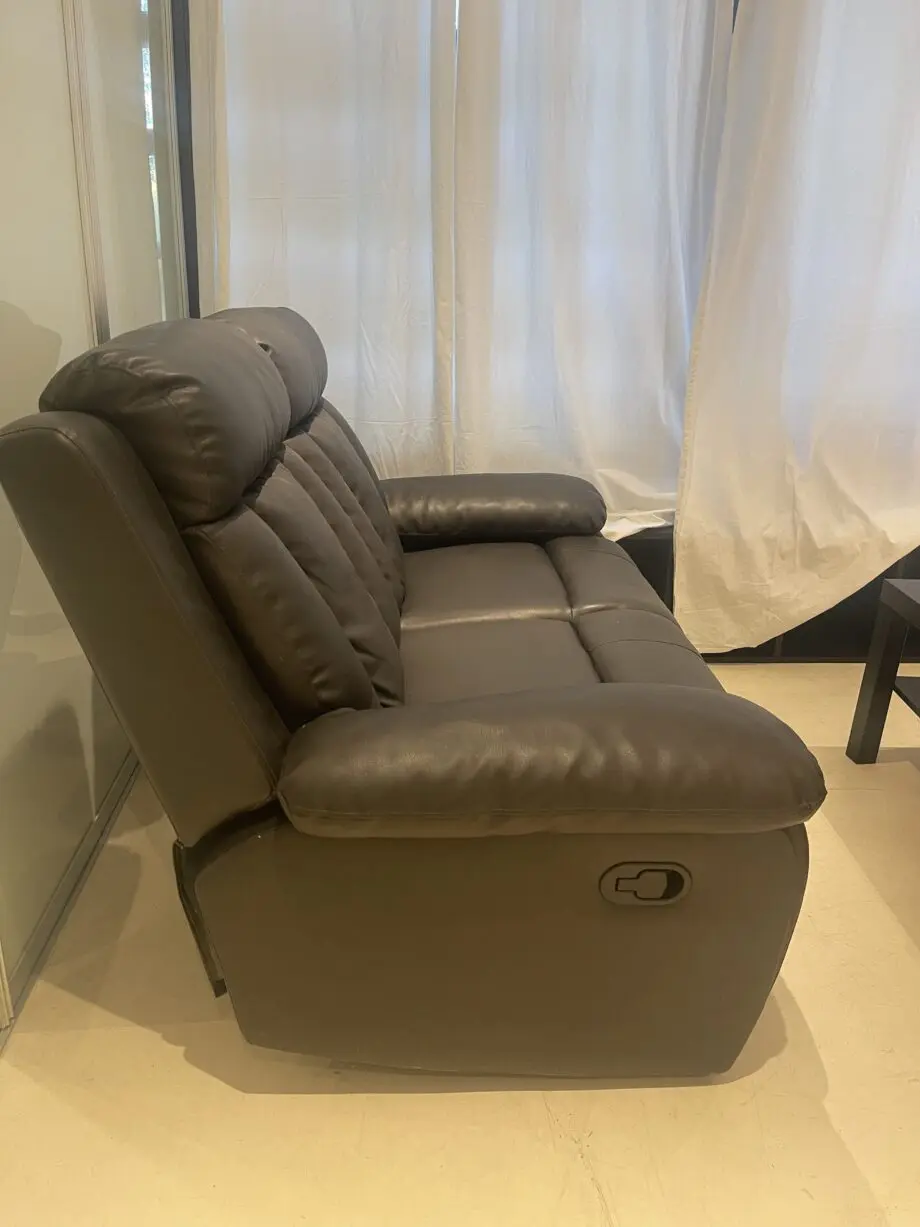 Used two seater faux leather sofa