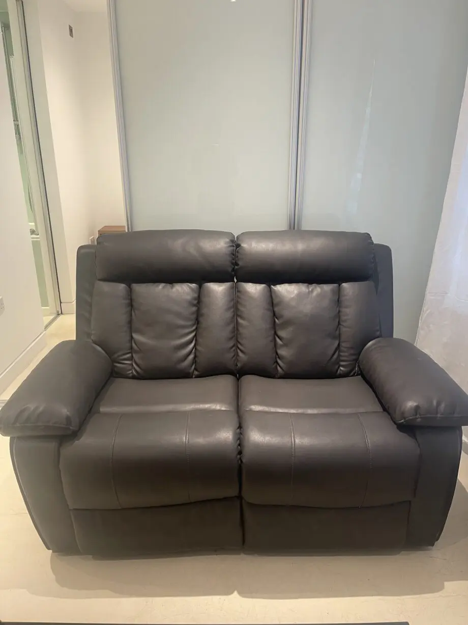 Used two seater faux leather sofa