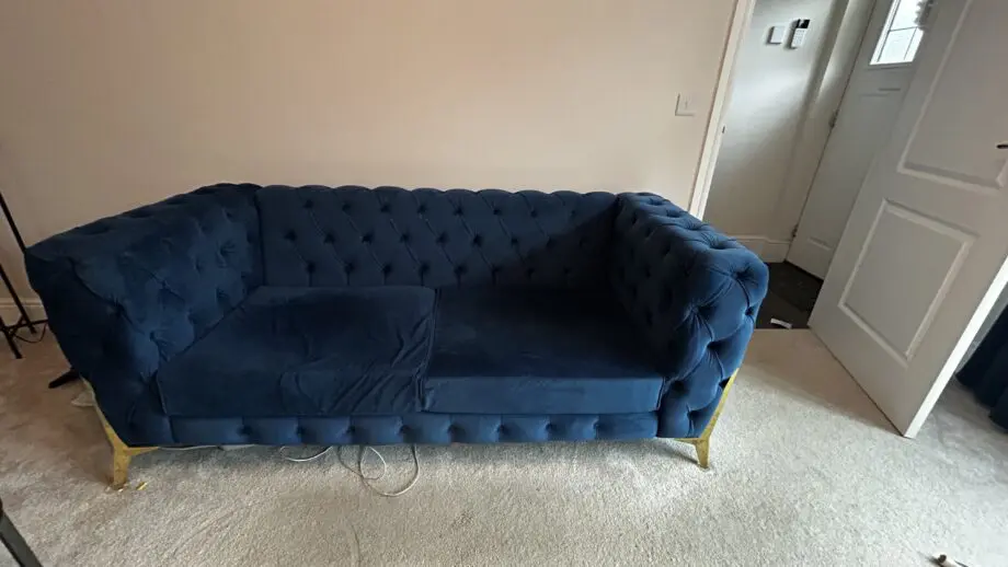 Royal blue chesterfield style fabric sofa